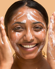 Image of woman using Plantkos Phyto Exfoliating Cleanser helps control blemishes